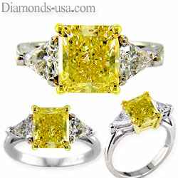 Yellow princess cut ring with two side triangle diamonds